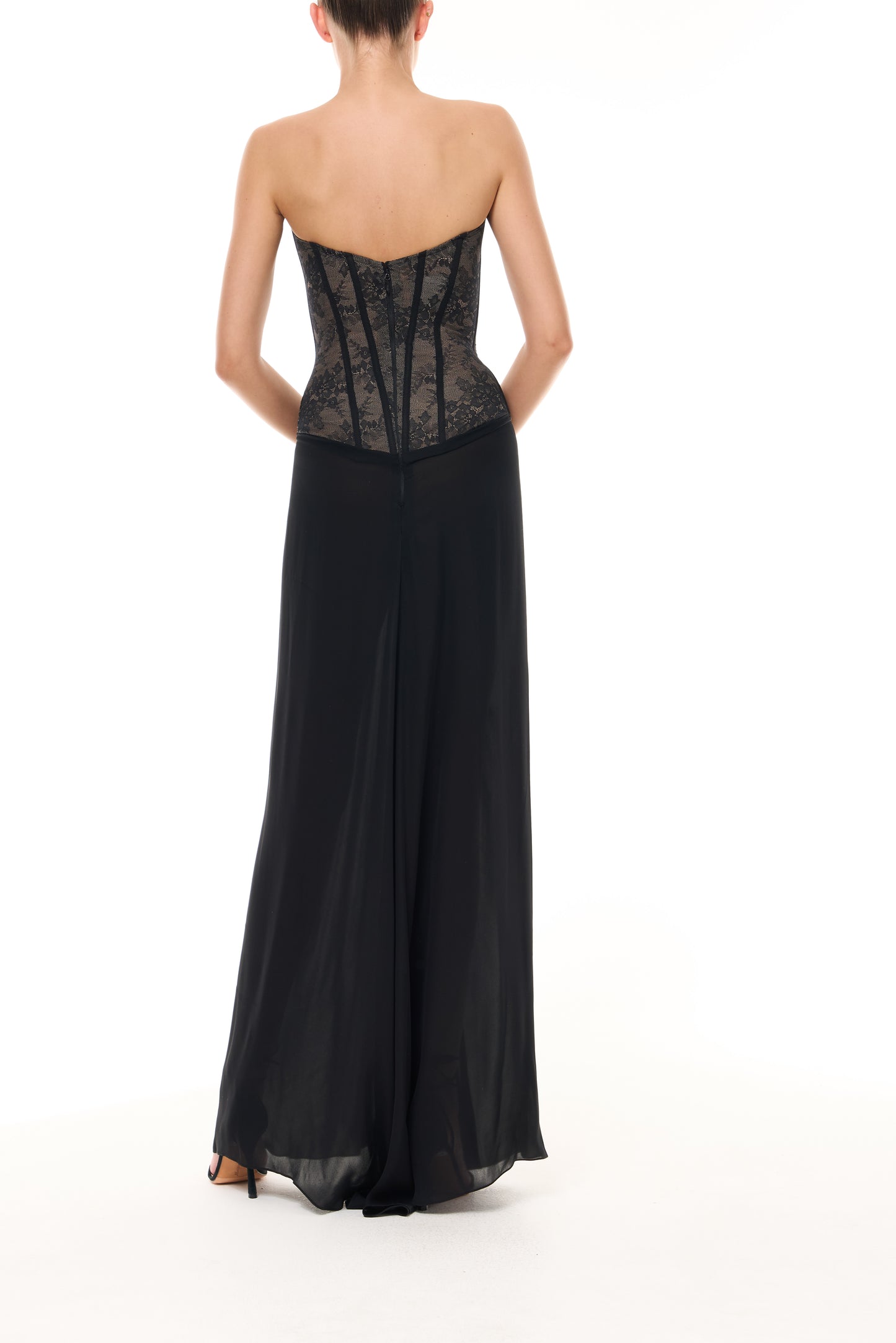Monique Lhuillier Spring 2026 Noir lace and georgette corseted dropped waist gown - back. 