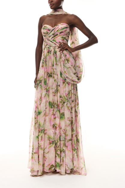 Monique Lhuillier Spring 2026 Carnation Multi Small Tulip Printed Chiffon Sweetheart strapless pleated gown with
shawl - side.