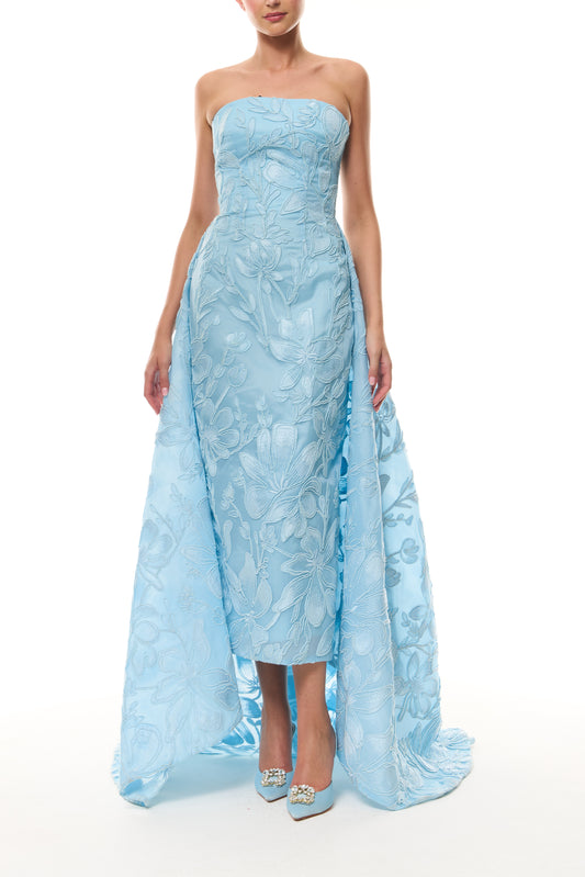 Monique Lhuillier Spring 2026 Plumeria Floral Corded Organza Strapless tea - length column gown with train - front.