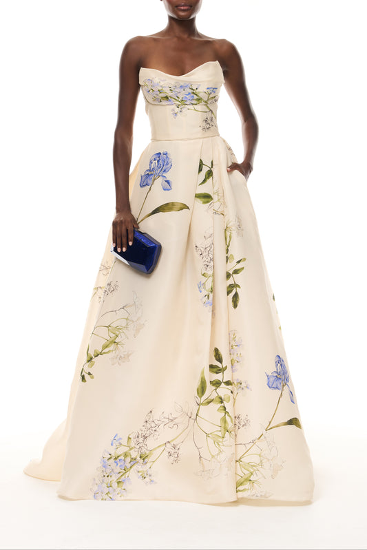 Monique Lhuillier Spring 2026 Ivory Multi Iris Bouquet Printed Gazar Draped bodice
ball gown with front skirt slit - front with Blue Dasha Minaudière
