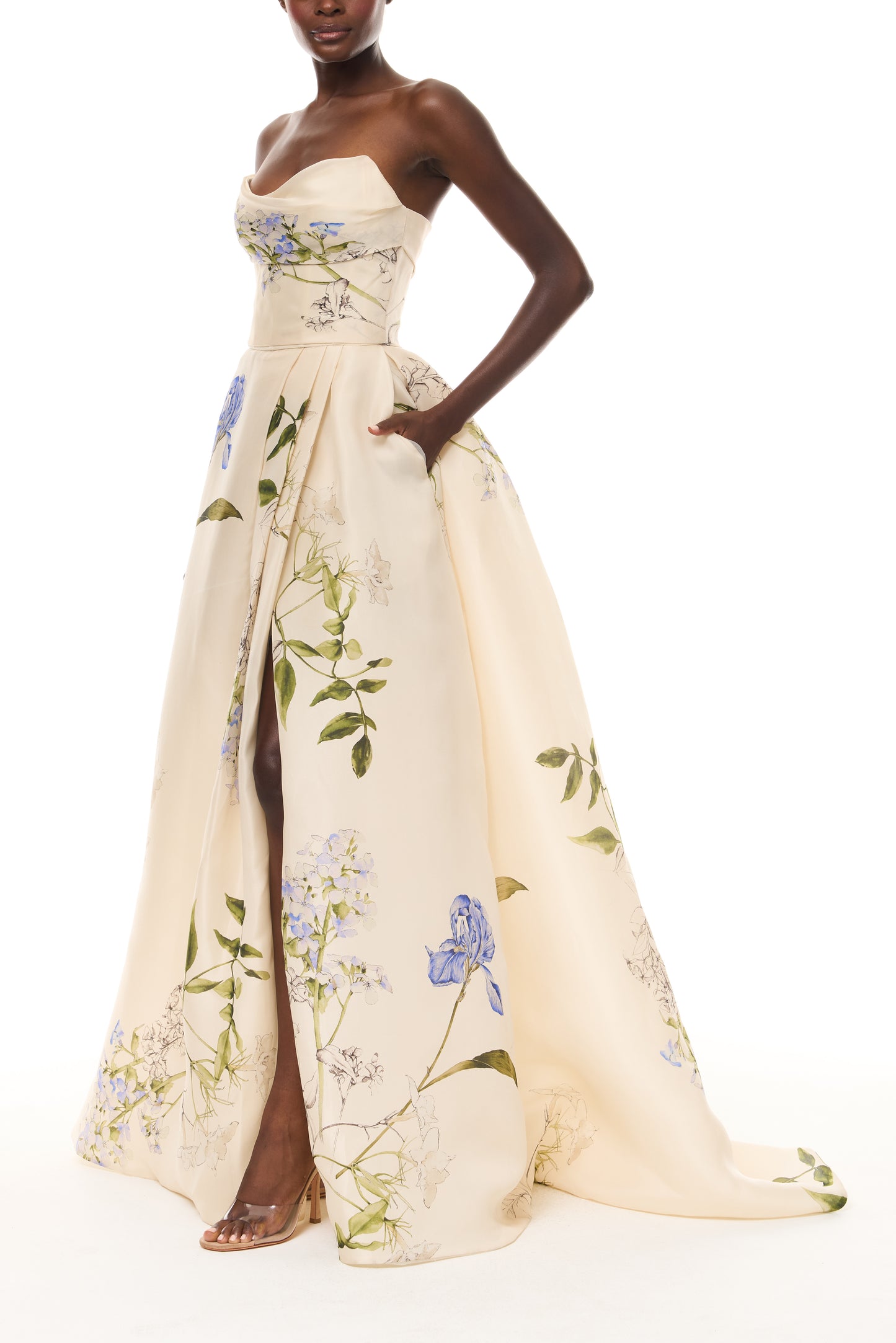 Monique Lhuillier Spring 2026 Ivory Multi Iris Bouquet Printed Gazar Draped bodice
ball gown with front skirt slit - side.