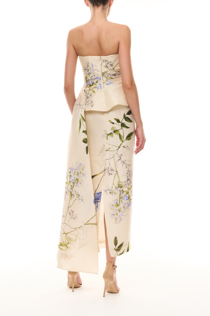 Monique Lhuillier Spring 2026 Iris Bouquet
Printed Gazar Strapless draped peplum gown - back.