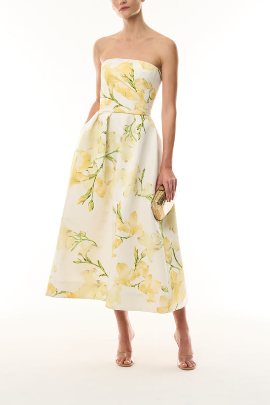 Monique Lhuillier pale yellow/multi Snapdragon Printed Faille Strapless Tea Length Dress - front with gold Dasha Minaudiere. 