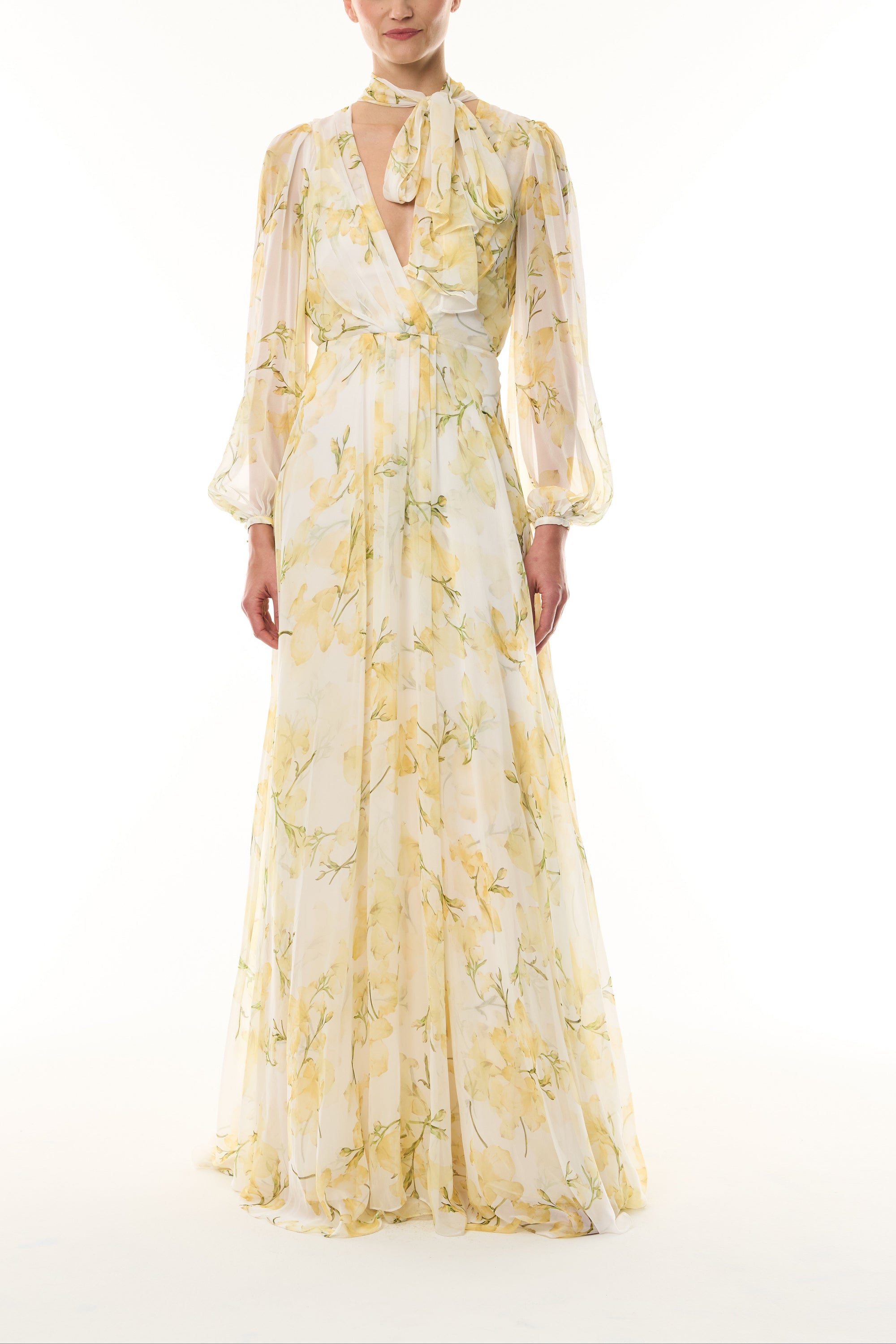 Monique Lhuillier Fall 2026 Pale Yellow/Multi Snapdragon Floral Printed Chiffon Draped V-neck long sleeve gown with blouson sleeves - front.