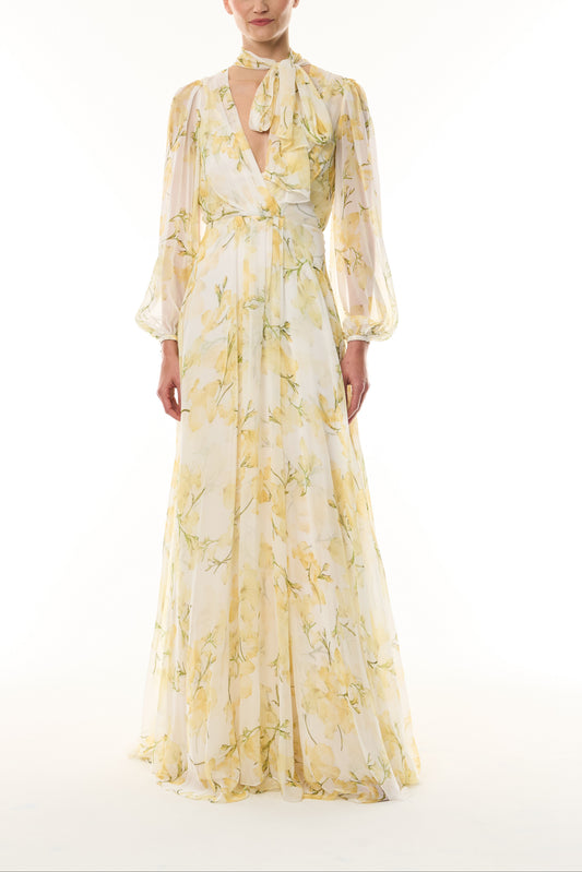 Monique Lhuillier Fall 2026 Pale Yellow/Multi Snapdragon Floral Printed Chiffon Draped V-neck long sleeve gown with blouson sleeves - front.