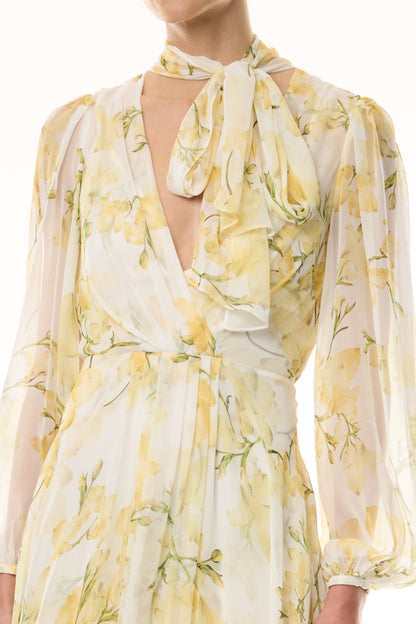 Monique Lhuillier Fall 2026 Pale Yellow/Multi Snapdragon Floral Printed Chiffon Draped V-neck long sleeve gown with blouson sleeves - fabric.