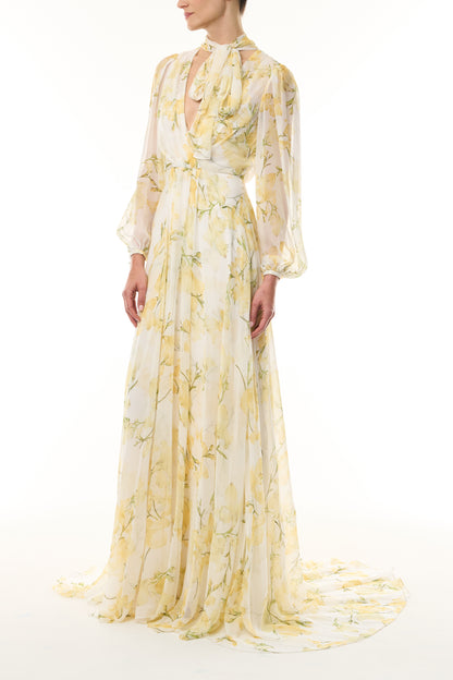 Monique Lhuillier Fall 2026 Pale Yellow/Multi Snapdragon Floral Printed Chiffon Draped V-neck long sleeve gown with blouson sleeves - side.