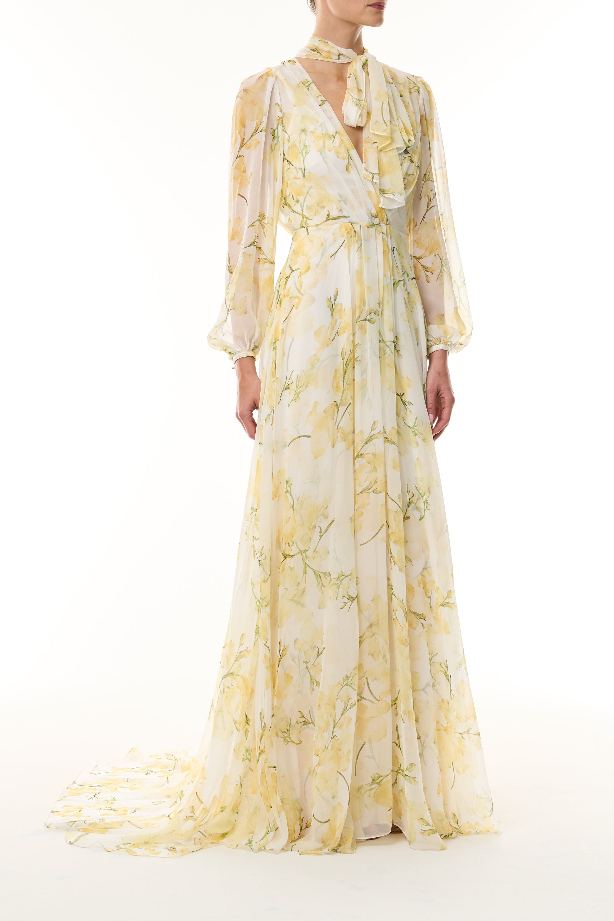 Monique Lhuillier Fall 2026 Pale Yellow/Multi Snapdragon Floral Printed Chiffon Draped V-neck long sleeve gown with blouson sleeves - front.
