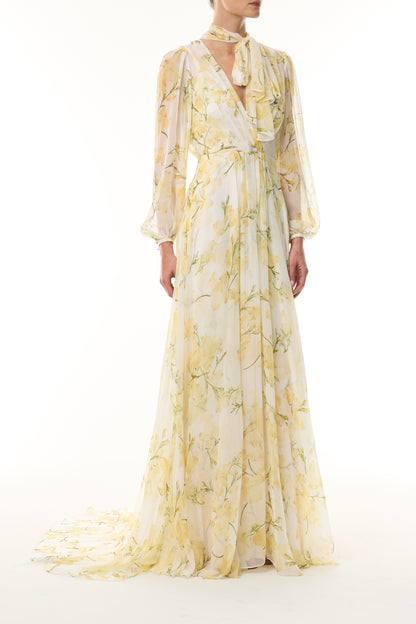 Monique Lhuillier Fall 2026 Pale Yellow/Multi Snapdragon Floral Printed Chiffon Draped V-neck long sleeve gown with blouson sleeves - front.