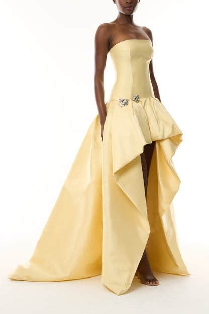 Monique Lhuillier Fall 2026 Pale Yellow Mikado Pique strapless ballgown with train and floral embellishment - side.