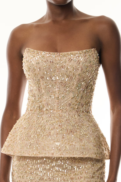 Monique Lhuillier Fall 2026 gold embroidered tulle strapless structured peplum column gown - fabric.