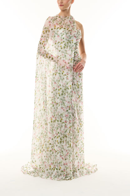Monique Lhuillier Fall 2026 Silk White/Multi Ivy Bloom Printed Silk Chiffon Strapless asymmetric draped bodice gown with coordinating side cape- side.
