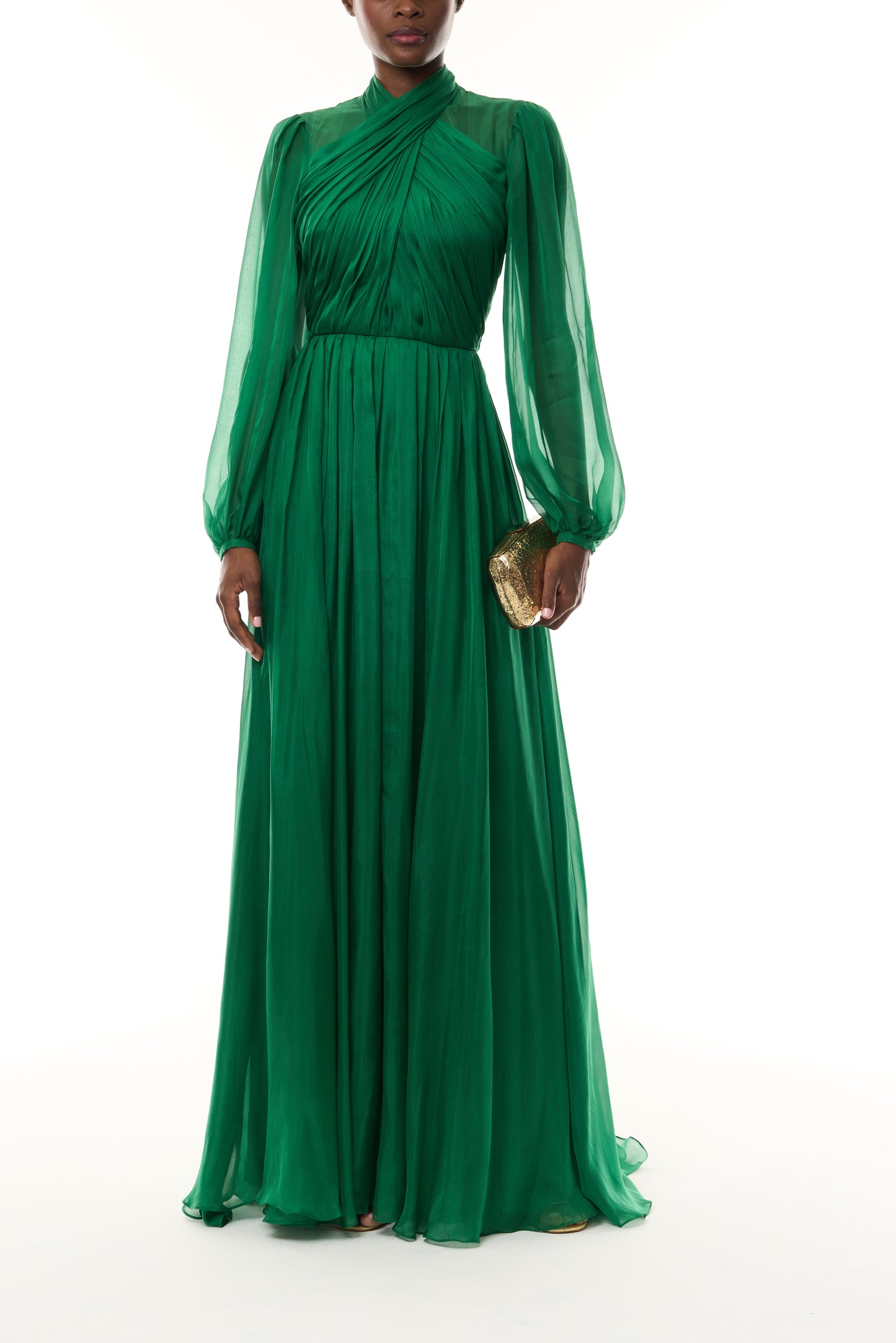 Monique Lhuillier Fall 2026 Sycamore Iridescent Chiffon long sleeve draped bodice gown - front with Gold Dasha Minaudiere.