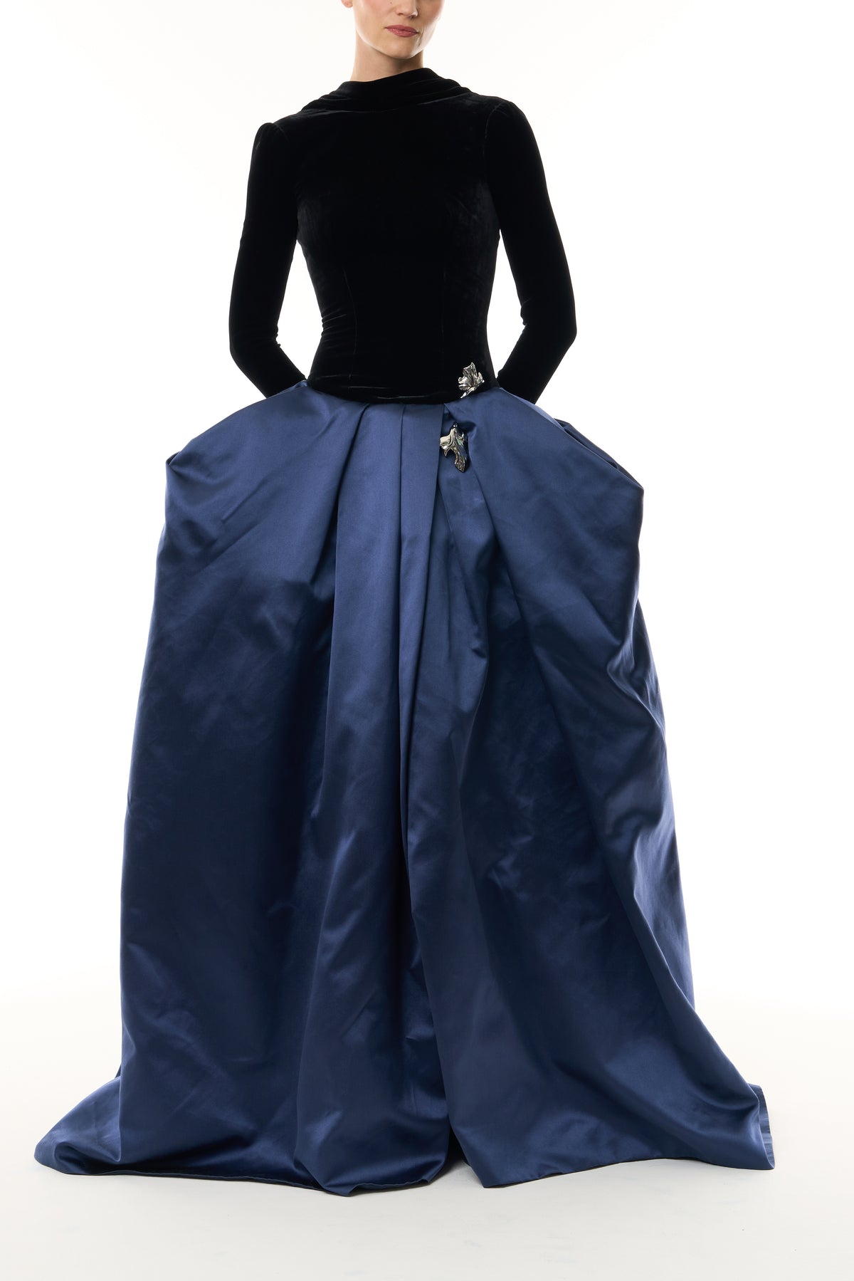 Monique Lhuillier Fall 2026 Noir and Navy Velvet and Duchess Satin long sleeve high neck pleated ballgown with silver floral embellishment - front.