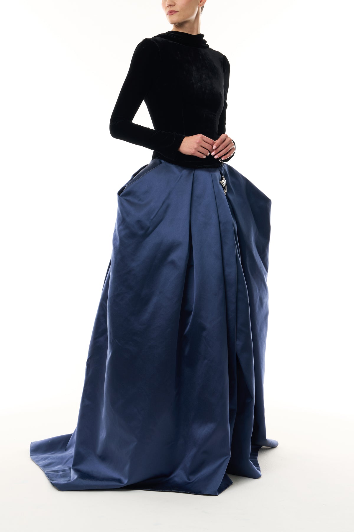 Monique Lhuillier Fall 2026 Noir and Navy Velvet and Duchess Satin long sleeve high neck pleated ballgown with silver floral embellishment - side.