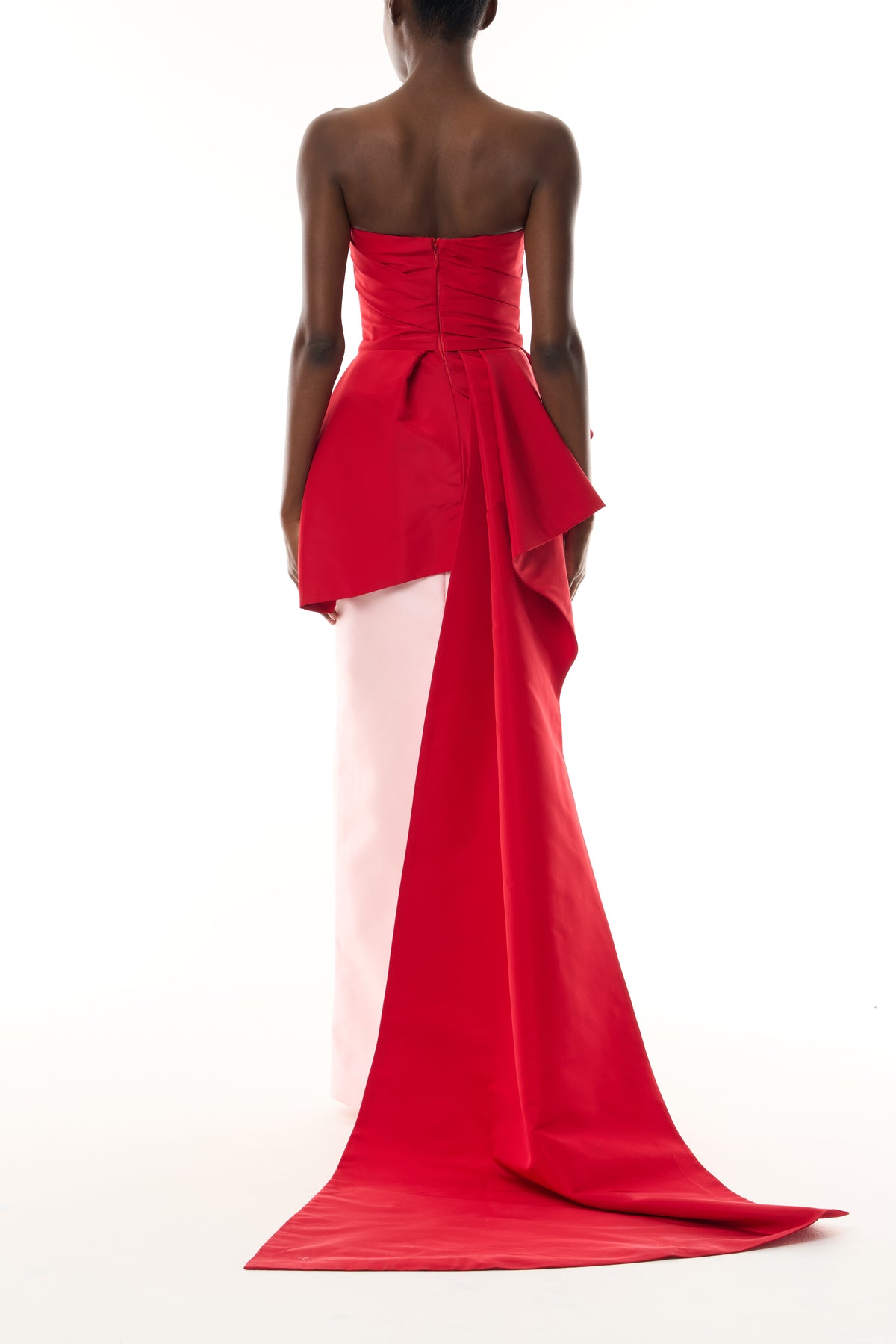 Monique Lhuillier Fall 2026 vibrant red and pale pink Silk Faille & Mikado strapless peplum bodice with column skirt and train - back. 