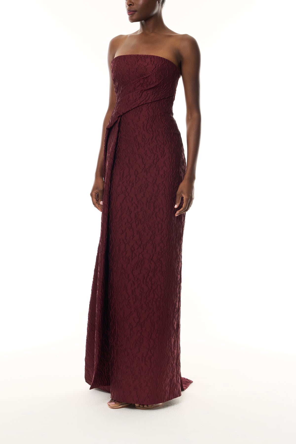 Monique Lhuillier Fall 2026 Rhubarb Jacquard strapless draped column gown with side train - side.