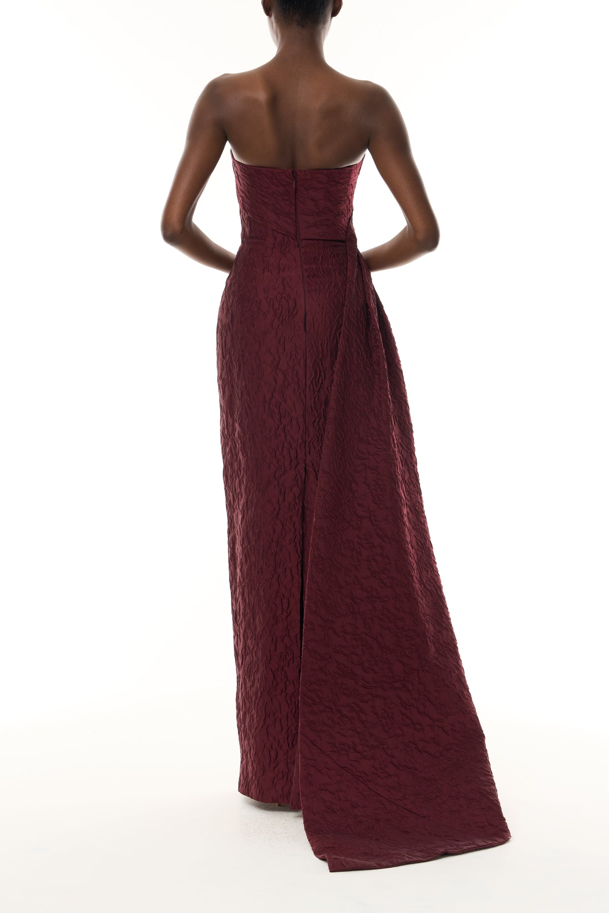 Monique Lhuillier Fall 2026 Rhubarb Jacquard strapless draped column gown with side train - back.