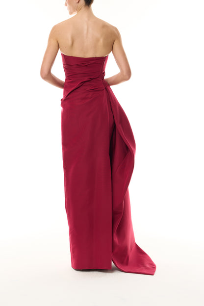 Monique Lhuillier Fall 2026 silk faille red strapless asymmetric draped column gown with side train - back.