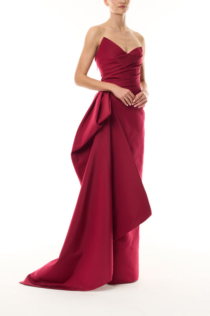 Monique Lhuillier Fall 2026 silk faille red strapless asymmetric draped column gown with side train - side.