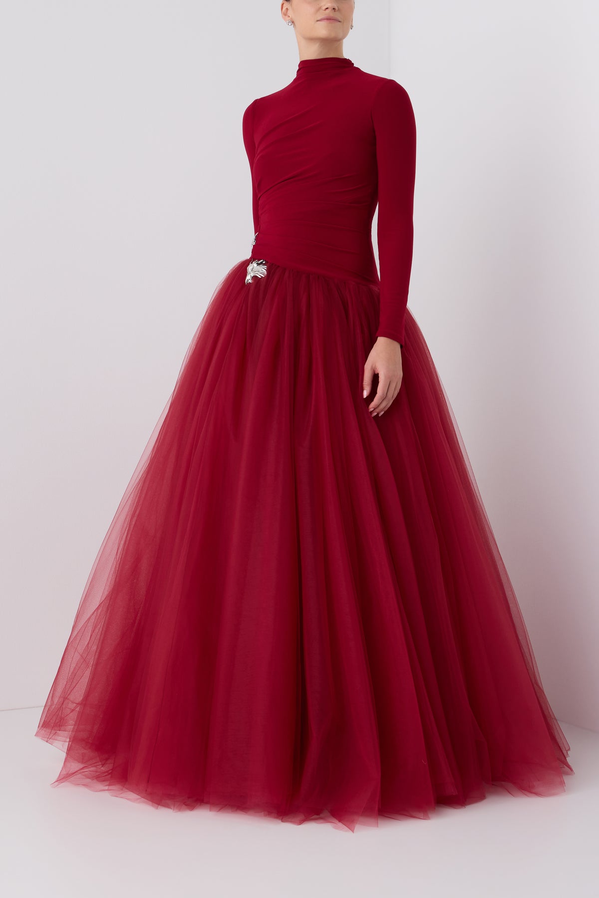 Monique Lhuillier Fall 2026 Rhubarb crepe jersey and tulle Long sleeve dropped waist floor-length gown with floral embellishment - side.
