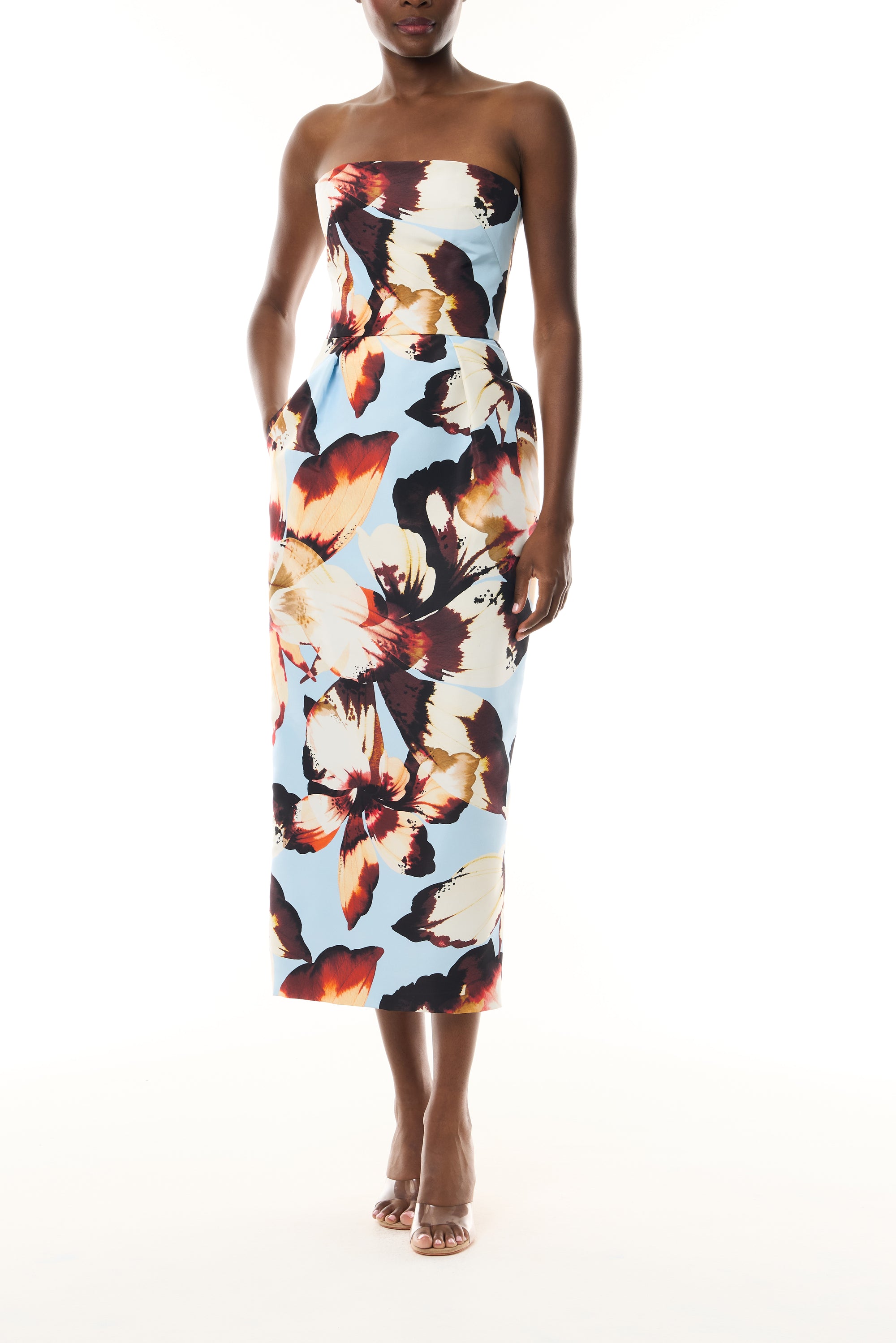 Monique Lhuillier Fall 2026 Pale Blue Amber Lily Printed Faille strapless pleated cocktail dress with pockets - front.