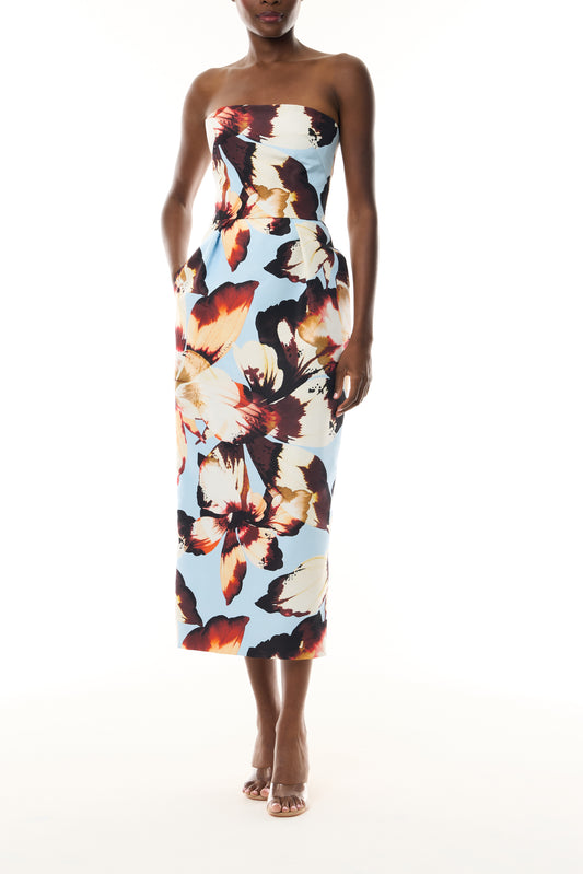 Monique Lhuillier Fall 2026 Pale Blue Amber Lily Printed Faille strapless pleated cocktail dress with pockets - front. 