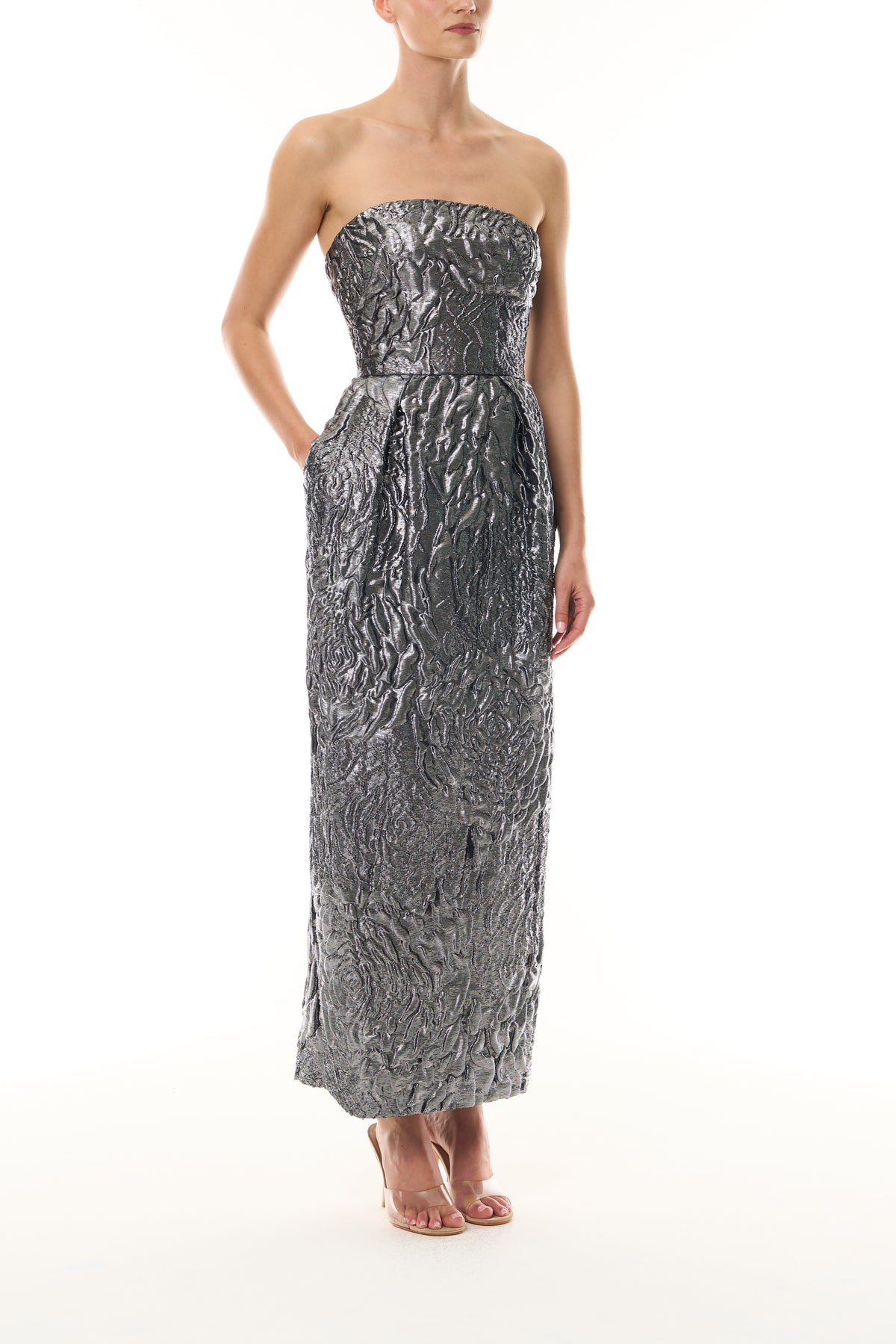 Monique Lhuillier Fall 2026 Chrome Lamé Rose Jacquard Strapless pleated cocktail dress with pockets  - side.