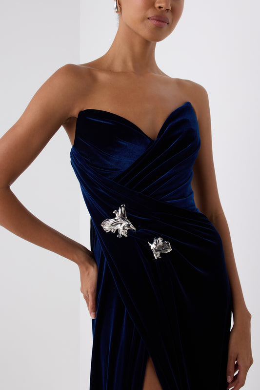 Monique Lhuillier Fall 2026 Navy stretch velour draped gown with slit and silver floral embellishment - fabric.