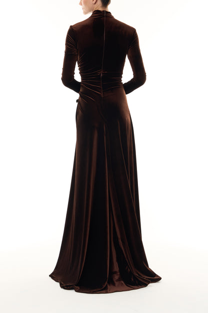 Monique Lhuillier Fall 2026 Café brown stretch velour high neck long sleeve gown with slit and gold floral embellishment -back.