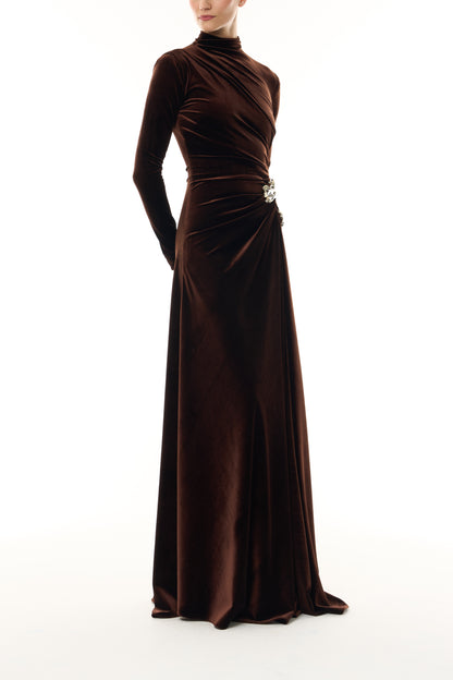 Monique Lhuillier Fall 2026 Café brown stretch velour high neck long sleeve gown with slit and gold floral embellishment - side.
