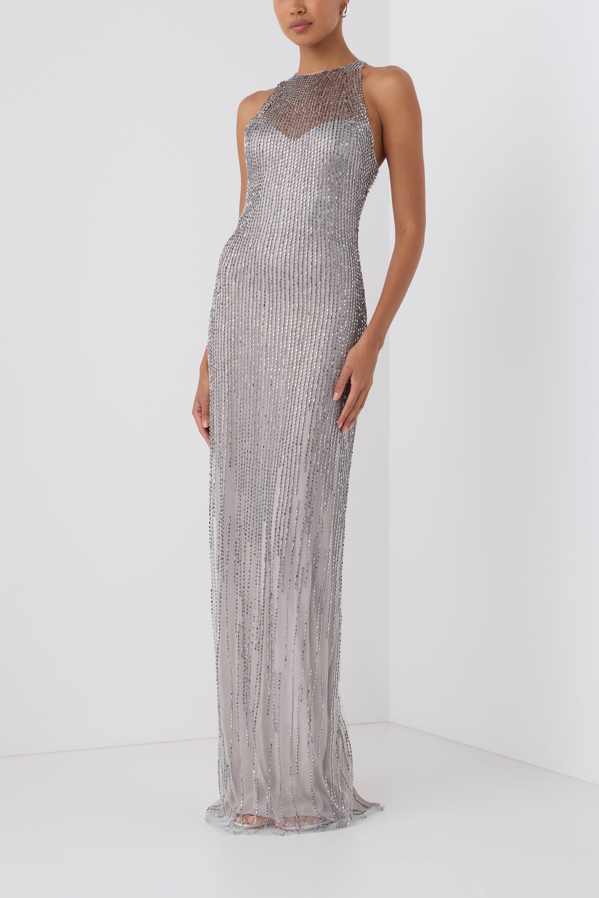 Monique Lhuillier Fall 2026 Silver embroidered tulle halter column gown - side.