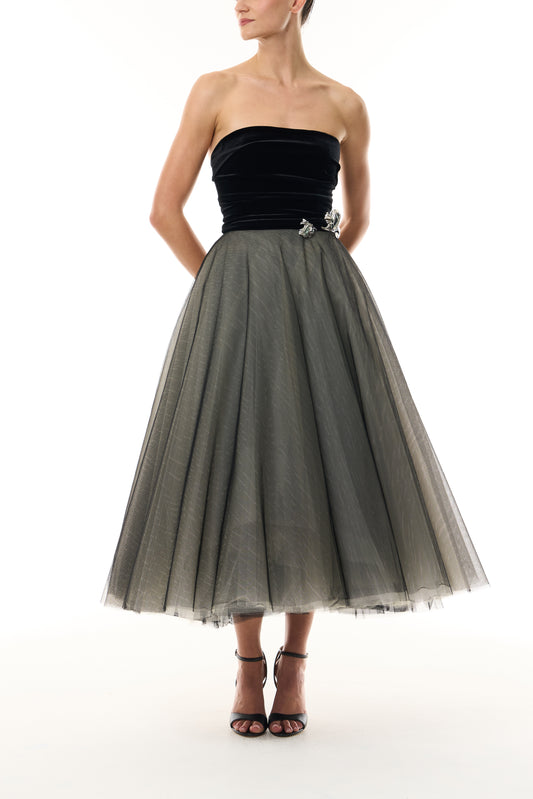Monique Lhuillier Fall 2026 Noir / multi Stretch Velvet & Tulle strapless tea length dress with floral embellishment - front. 