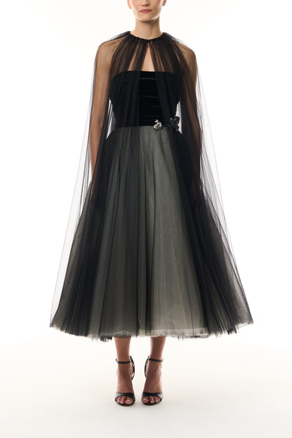 Monique Lhuillier Fall 2026 Noir / multi Stretch Velvet & Tulle strapless tea length dress with floral embellishment and coordinating noir tulle cape - front.