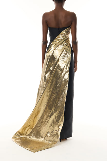 Monique Lhuillier Fall 2026 Noir/Gold lamé and faille strapless draped column gown and train - back.