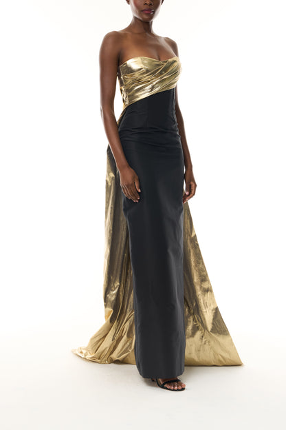Monique Lhuillier Fall 2026 Noir/Gold lamé and faille strapless draped column gown and train - side.