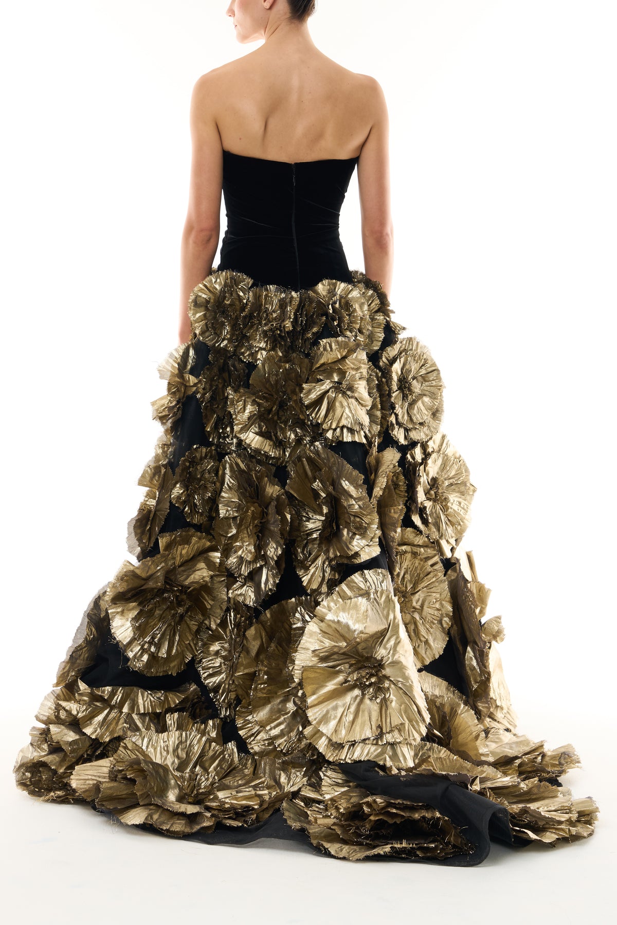 Monique Lhuillier Fall 2026 Noir/Gold velvet and embroidered lamé strapless dropped ballgown with three-dimensional floral skirt - back.