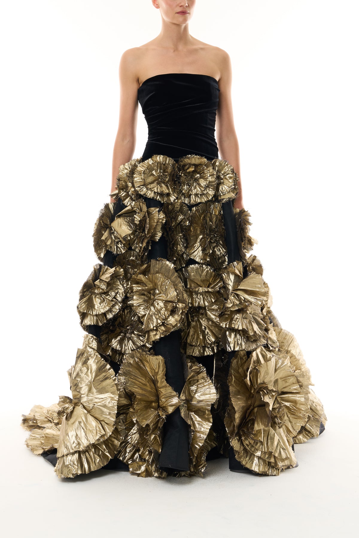 Monique Lhuillier Fall 2026 Noir/Gold velvet and embroidered lamé strapless dropped ballgown with three-dimensional floral skirt - front.