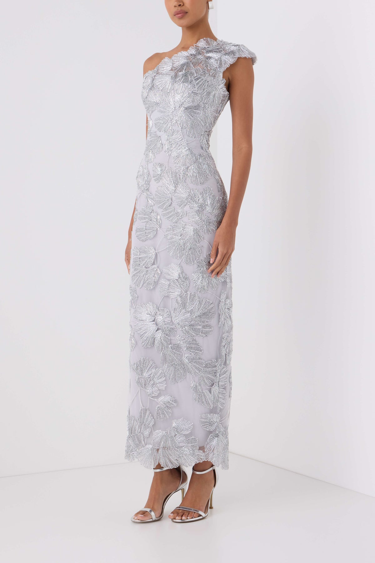Monique Lhuillier Spring 2027 silver embroidered tulle one-shoulder tea length column gown - side. 
