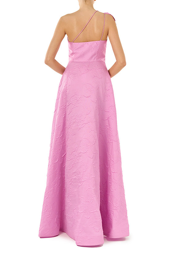 ML Monique Lhuillier floor length dress in orchid jacquard fabric with one shoulder and bow neckline.