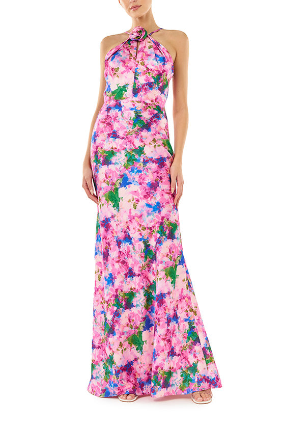 ML Monique Lhuillier Spring 2024 floor length dress with rosette, halter neckline and low V-back in Waterlily Floral crepe-back satin - front.