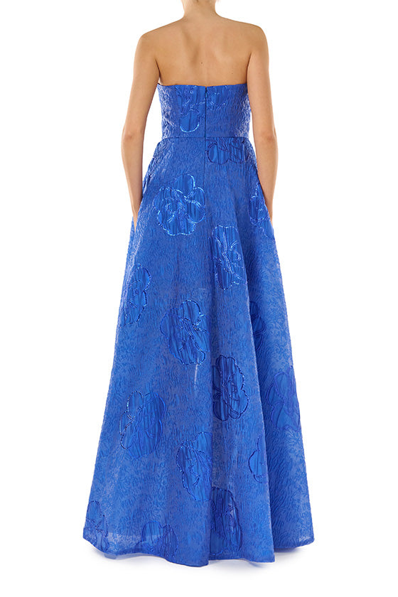 ML Monique Lhuillier Spring 2024 strapless gown with high-low hem in metallic royal blue - back.