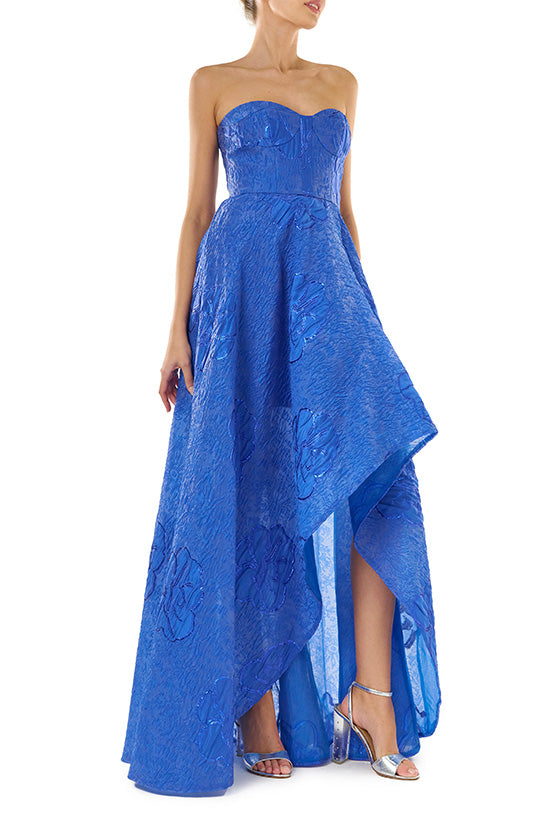 ML Monique Lhuillier Spring 2024 strapless gown with high-low hem in metallic royal blue - side one.