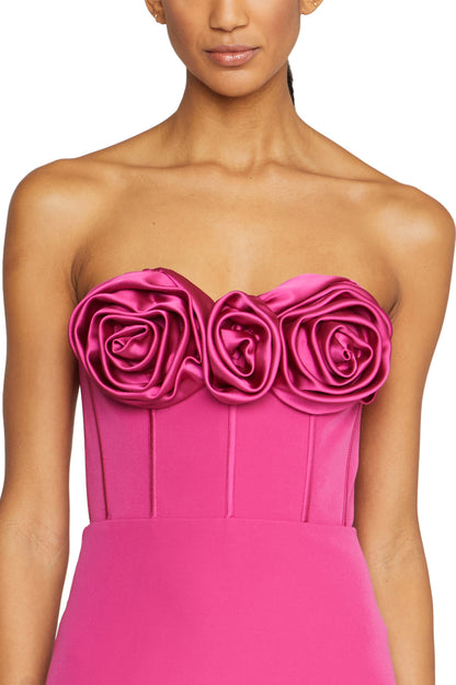 Strapless column gown with corseted bodice and rosette detail at front neckline in Cerise Pink crepe- front detail