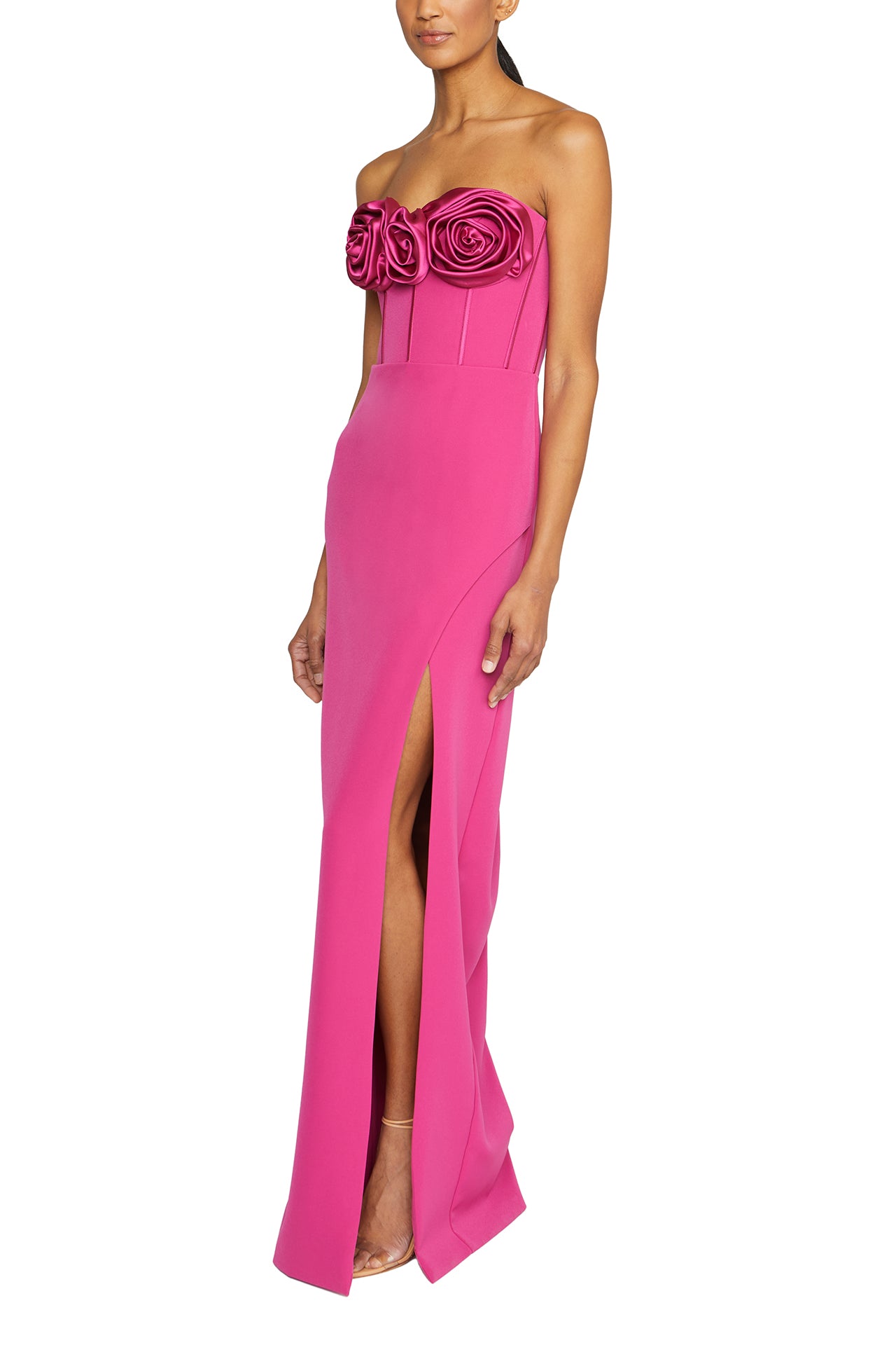 Strapless column gown with corseted bodice and rosette detail at front neckline in Cerise Pink crepe- side