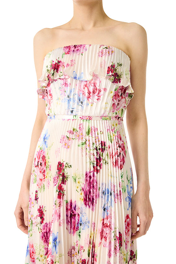 Strapless long dress in floral print satin with pleated skirt and ruffle neckline.