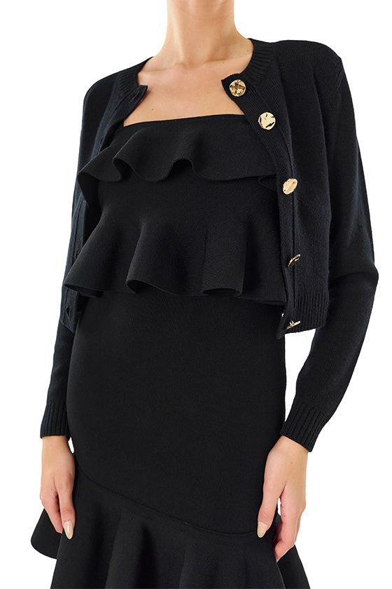 Monique Lhuillier black knit ruffle top with spaghetti straps and gold back zipper.