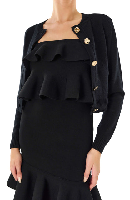 Monique Lhuillier black long sleeve cropped cardigan with gold buttons.