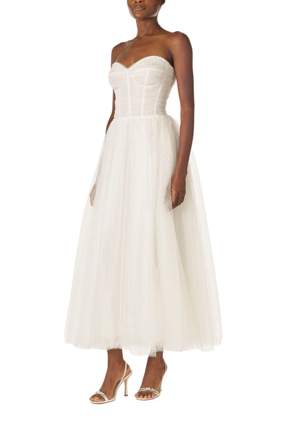 Monique Lhuillier "Brie Dress". 
 Strapless, tea length dress with sweetheart neckline in French Dot Tulle - left side.