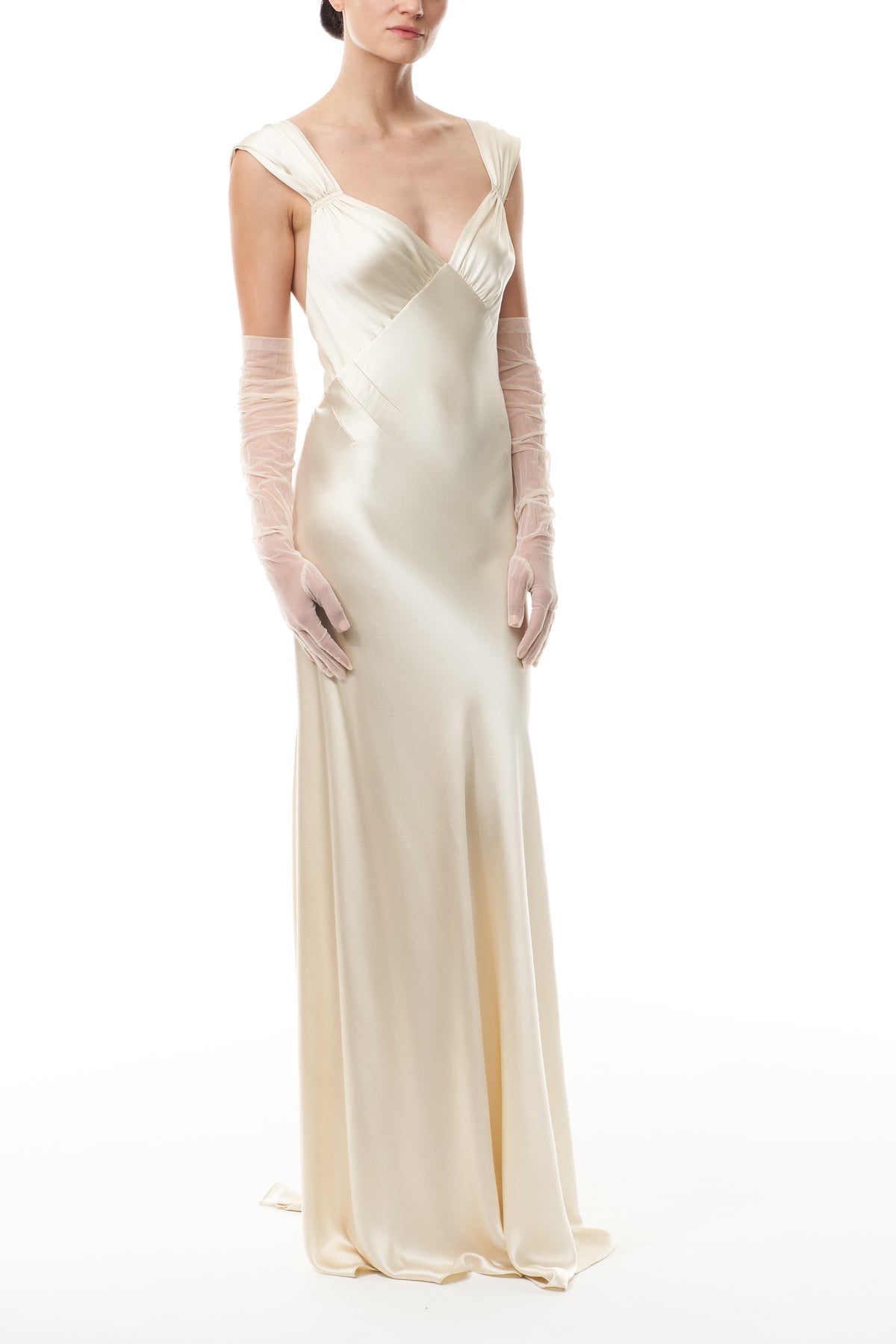 Opera length gloves in blush tulle.  Shown with an ivory satin gown.